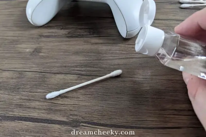 Apply isopropyl alcohol to a cotton swab